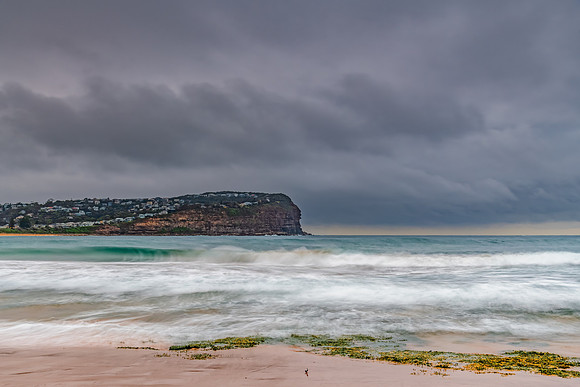 Rainy day sunrise at the beach