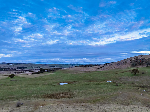 Twilight skies with cloud cover over the countryside