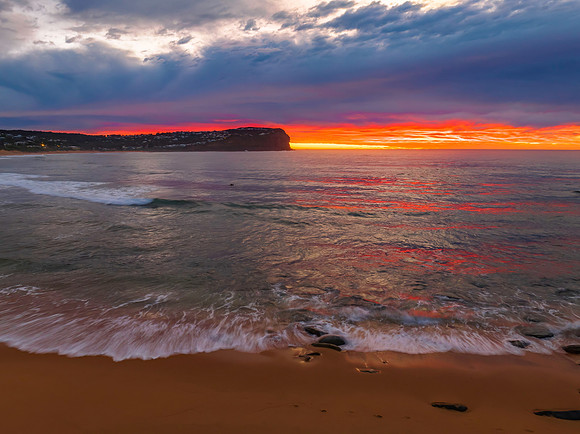 Cloud filled sunrise seascape