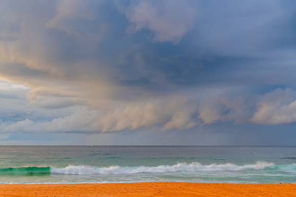 Sunrise at the Seaside with rain clouds