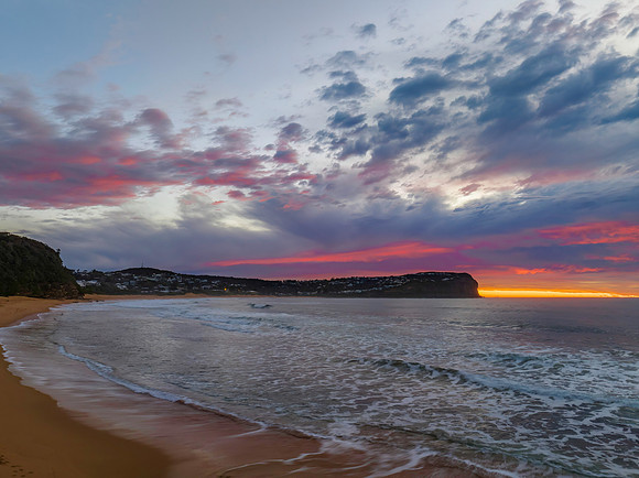 Cloud filled sunrise seascape