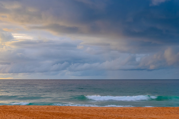 Sunrise at the Seaside with rain clouds