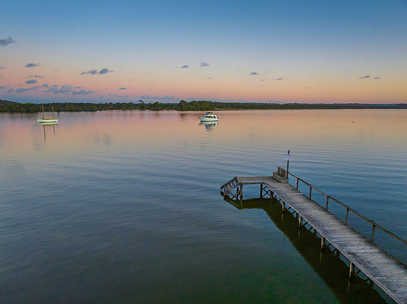 Sunset over the river with boats