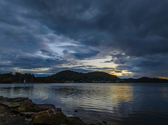 Stormy sunrise skies over the bay