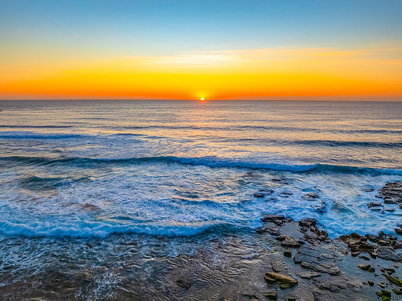 Sunrise at the Seaside with an Orange Horizon
