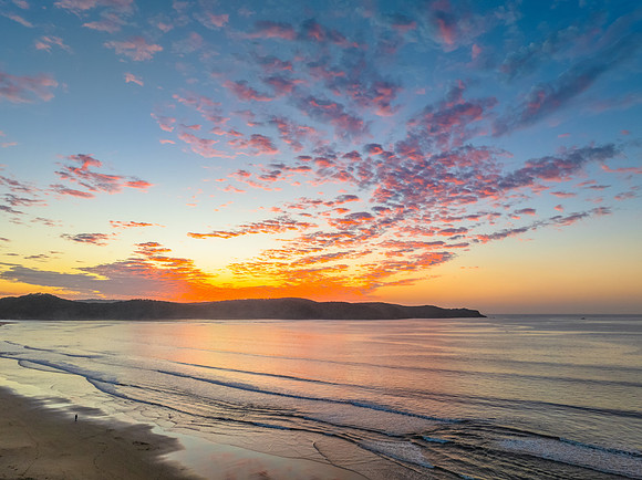 Sunrise seascape with pretty clouds in the sky