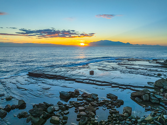 Sunrise over the ocean and rocky Inlet