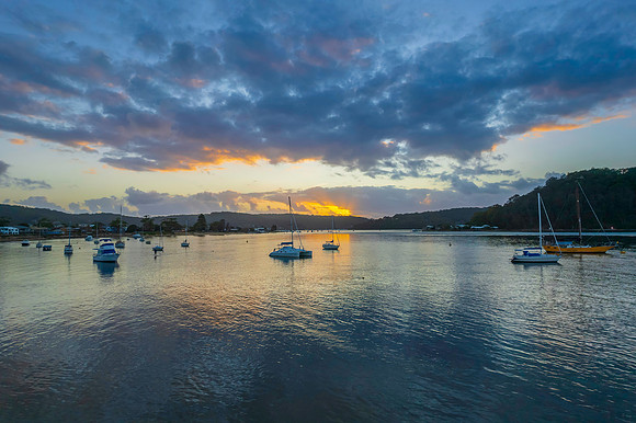 Aerial sunrise waterscape with boats