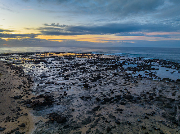 Sunrise with clouds and rocks