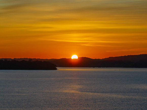 Aerial sunrise waterscape and high cloud